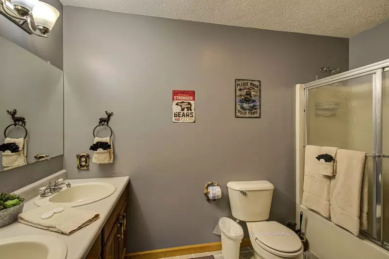 Bathroom located in hallway area near Bedroom 1.